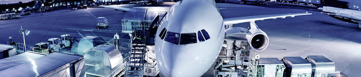 Cargo plane being loaded at night, elevated view